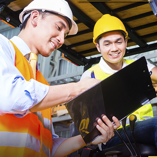 Operator Trainer with trainee going over inspection report